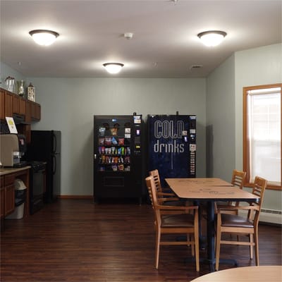 Common area with vending machines and seating