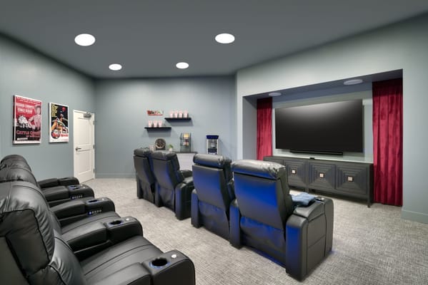 Cozy movie theater room with reclining seats