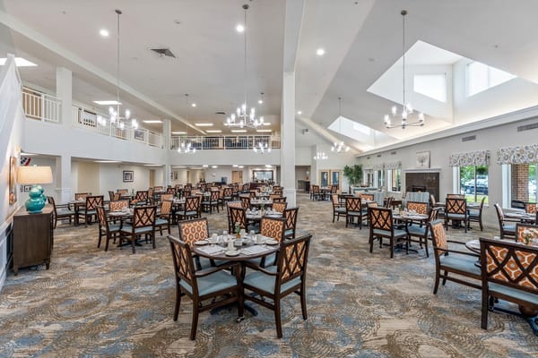 Spacious dining area with tables set for meals