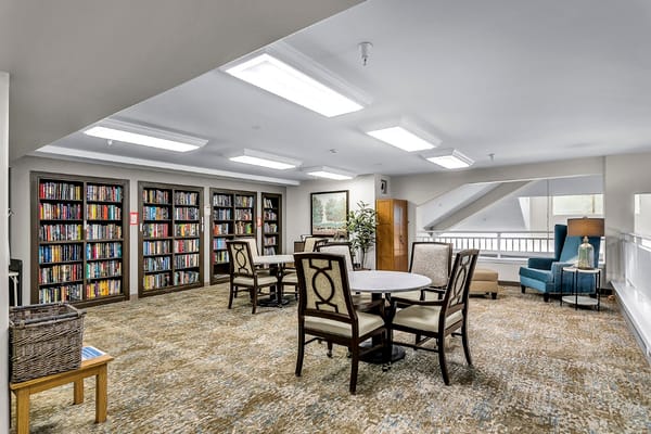 Cozy library area with bookshelves and seating