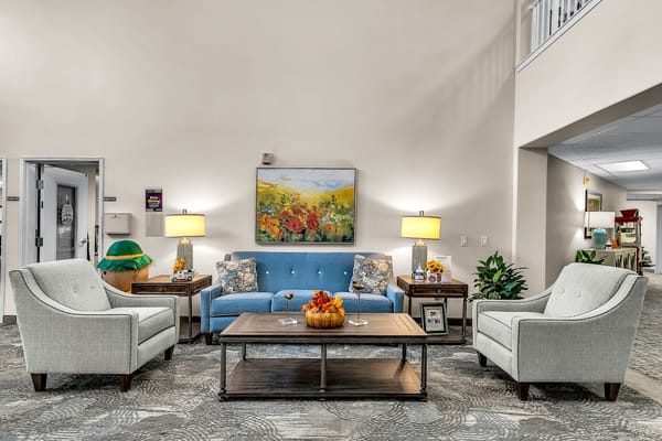 A serene living room with comfortable seating and decorative table.