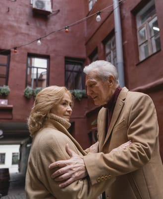A couple embracing in a charming courtyard