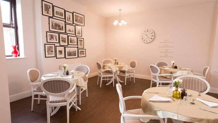 Bright dining area with tables set for meals