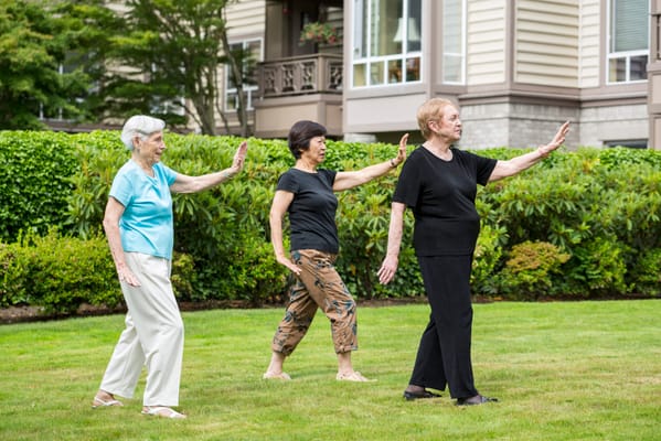 Residents participating in an outdoor exercise activity