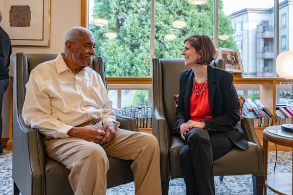 Resident and staff member engaging in conversation