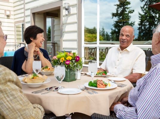 Residents enjoying a meal together outdoors