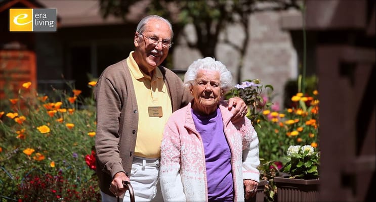 Two residents enjoying the garden at the facility