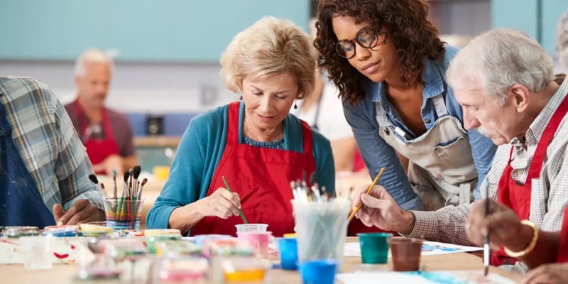 Residents participating in a painting activity