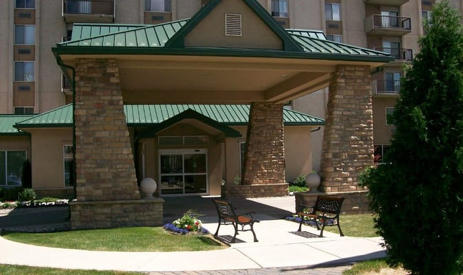 Entrance of Maple Heights Senior Living with outdoor seating