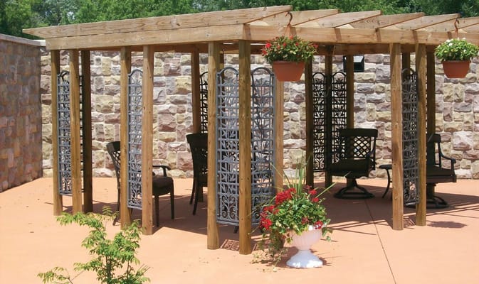 Outdoor seating area with wooden structure and plants