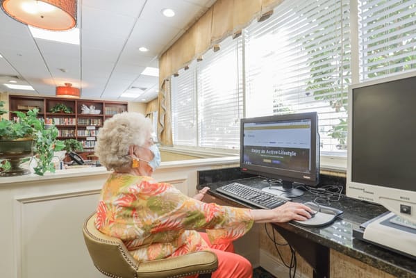 Resident using a computer in a common area