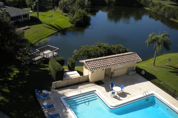 Aerial view of a swimming pool by a lake
