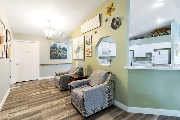 Common area with seating and decorative walls