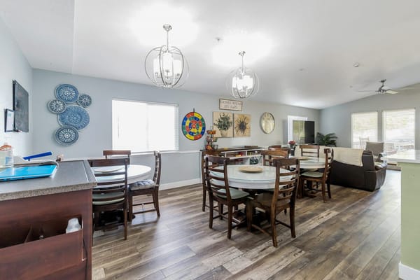 Bright and inviting dining area with tables and chairs