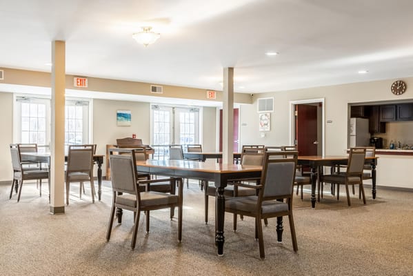 Bright dining room with tables and chairs arranged