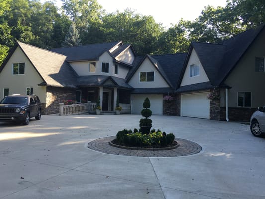 Exterior view of a senior living facility with landscaped garden
