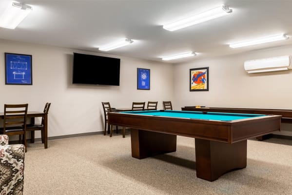 Common area with a billiard table and seating