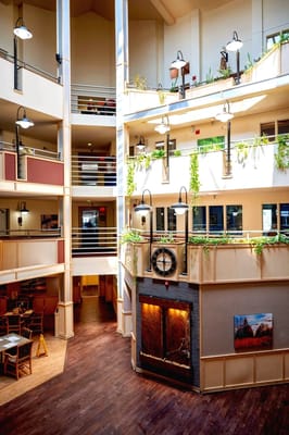 Bright interior common area with seating and fireplace