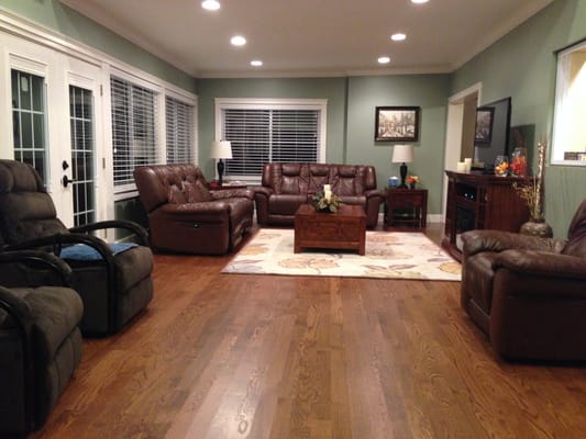 Cozy common area with leather seating and wooden floor