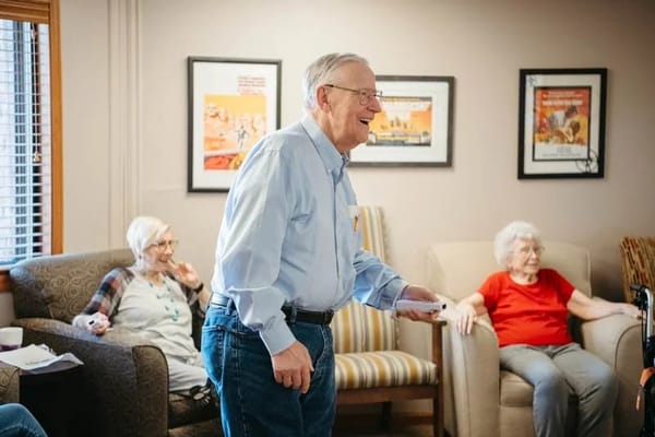 Residents enjoying a game in a common area