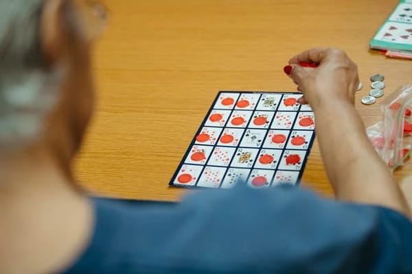 Resident playing bingo at a table