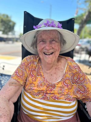 Happy resident outdoors enjoying the sunshine