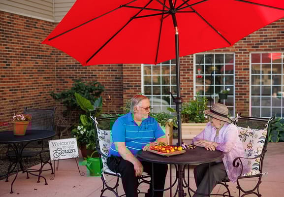 Residents enjoying snacks in a garden area