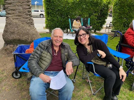 A resident and staff member enjoying the outdoors
