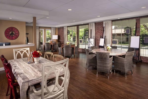 Bright common area with tables and chairs