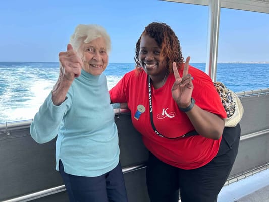 A resident and staff member enjoying a boat ride