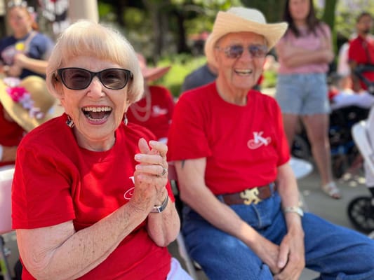 Residents enjoying an outdoor event with smiles