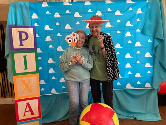 Residents enjoying a fun photo booth activity