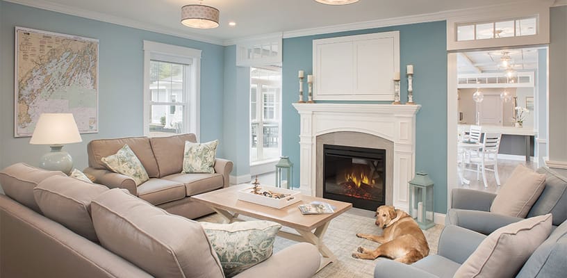 A cozy common area with comfortable seating and a dog resting