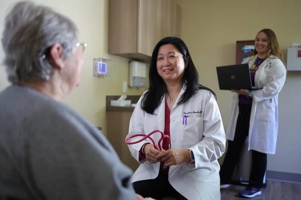 Medical professional consulting with a patient