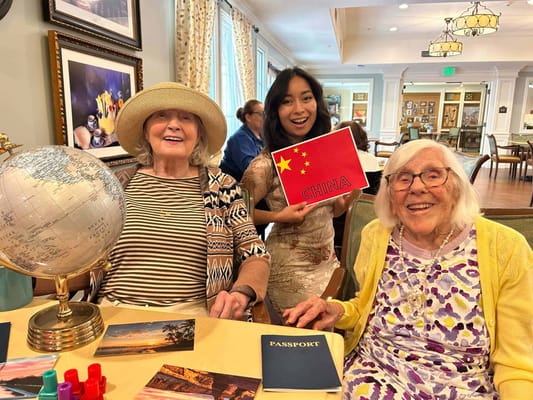 Residents engaging in a fun activity with a globe