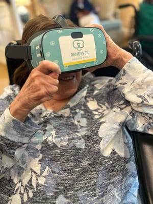 Resident using virtual reality headset in common area