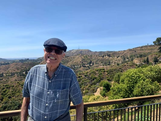 Smiling resident outdoors with scenic mountain view
