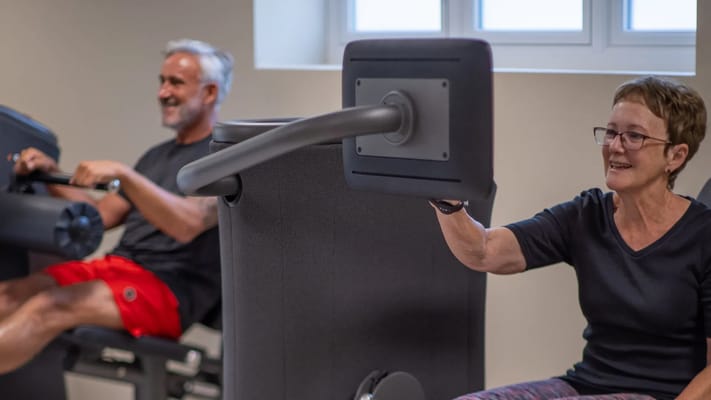 Residents exercising in a fitness room