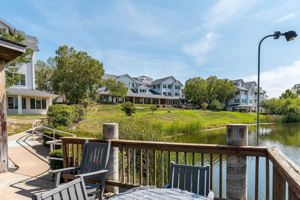 Exterior view of the facility with landscape and water