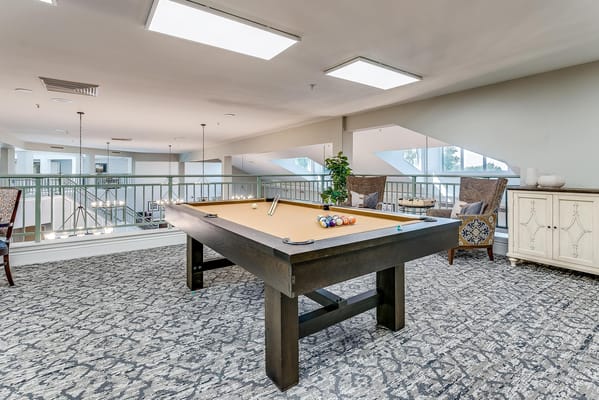 Common area with billiards table and seating