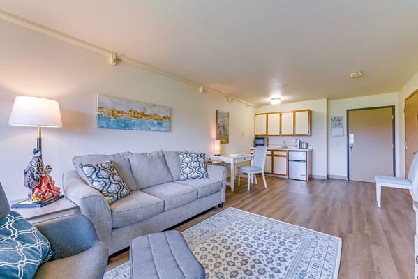 Bright and spacious resident living room with a kitchenette