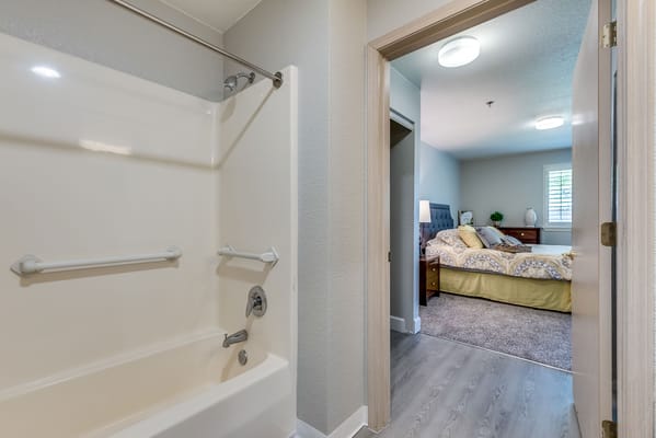 A view of a private resident room and bathroom
