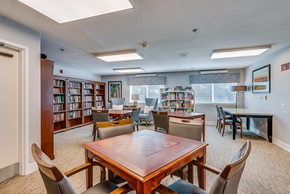 Bright common area with bookshelves and seating