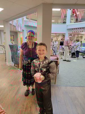 Residents enjoying a festive gathering with children