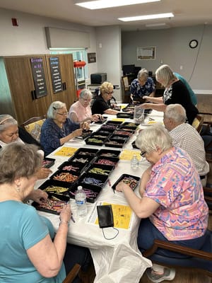 Residents engaged in an arts and crafts group activity