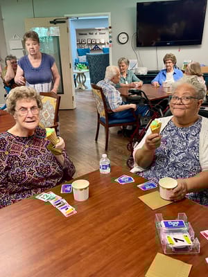 Residents engaging in a card game activity