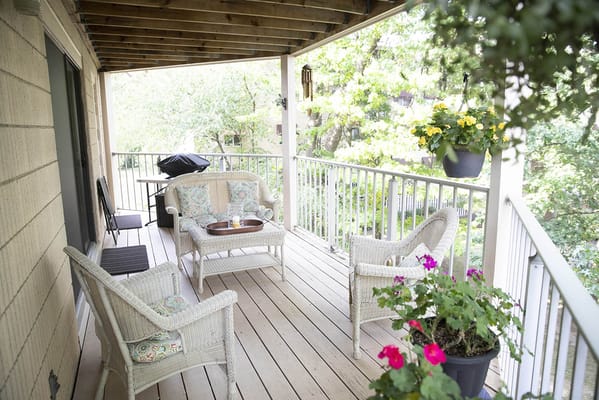 Cozy outdoor seating area with plants