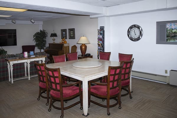A common area with a large table and seating