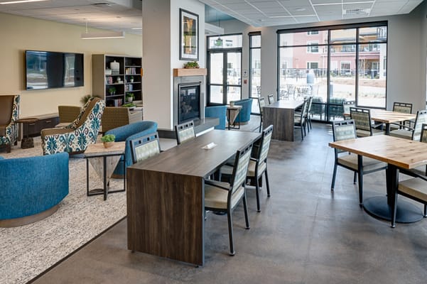 Bright common area with seating and tables