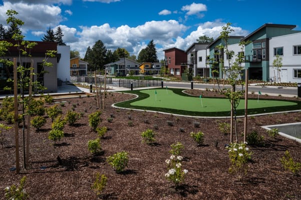 Outdoor green space with walking paths and residences